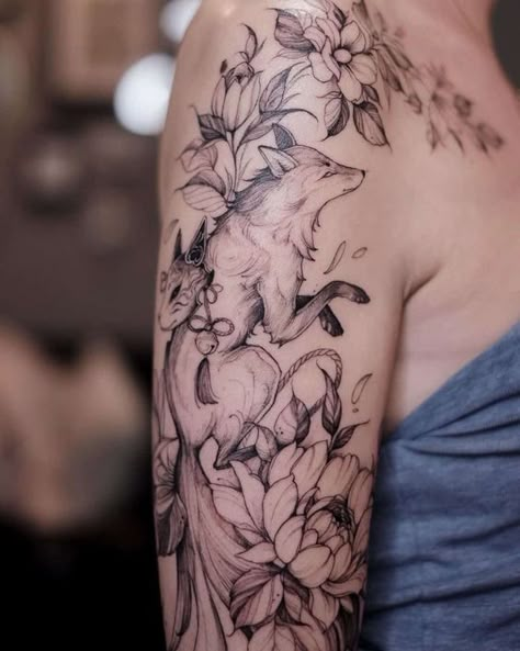 20 Best fox tattoo designs for you Fox Tattoo Flowers, Fox Flowers Tattoo, Fox Tattoo Shoulder, Floral Fox Tattoo, Fox Flower Tattoo, Fox Tattoo Arm, Flower Animal Tattoo, Fox And Flowers Tattoo, Black Fox Tattoo