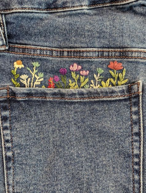 This wildflower embroidery design pattern is perfect for adding a bit of flair to any article of clothing. It can be used for a pants pocket, hat, shirt pocket, or even just on its own. The floral pattern is beautiful and timeless. Simply print out the pattern and either trace onto your cloth using a water soluble pen or print directly onto transfer paper. The pattern is sized to be roughly 5 inches wide however you can scale it if necessary to fit on your article of clothing or fabric.  🪡I hav Embroidery On Shorts, Embroidery Clothing Ideas, Hand Embroidery On Sweatshirts, Pant Embroidery Design, Design For Pants, Jean Pocket Embroidery, Pocket Embroidery Design, Embroidery On Jeans, Wildflower Embroidery