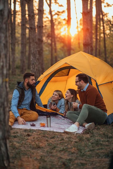 Four young friends sitting outside their tent drinking hot beverages and socializing, look at the happiness of their face | camping photography Camping Photoshoot, Photoshoot Friends, Sitting Outside, Camping Photography, Hot Beverages, Friend Photoshoot, Styled Shoot, Outdoor Bed, Hot Drink