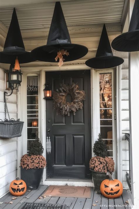 38 Stunning Fall + Halloween Porch Decor Ideas - Styling Her Life Red Brick House Halloween Decor, Harry Potter Front Porch Decor Halloween, Halloween Outside Entryway Decor, Witch Halloween Front Porch, Classic Halloween Porch Decor, Halloween Front Gate Decorations, Halloween Banister Ideas, Halloween Wrap Around Porch Decorations, Garage Fall Decor