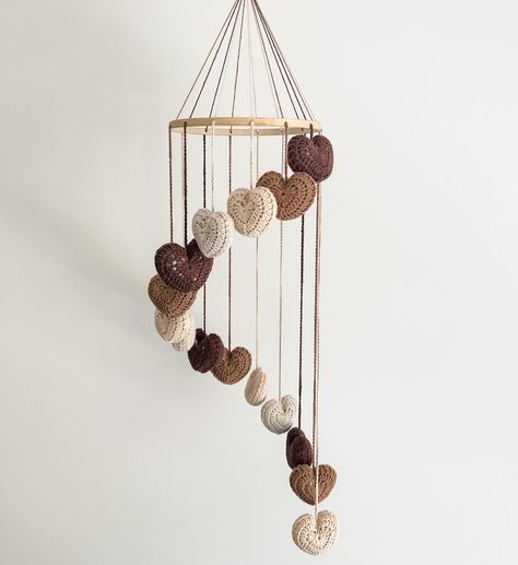 Our ‘Little Love’ neutral mobile is the dreamiest addition to your gender neutral/boho nursery 😍🤎 Did you know we also make custom mobiles in any colour of your choosing? Check out the colour range online today! . . . . . #maggieandmay #mobile #nurserydecor #babymobile #bohonursery #beigenursery #beigebaby #genderneutral #genderneutralnursery #neutralnursery #crochet #customcrochet Crochet Mobile Baby, Crocheted Hearts, Beige Nursery, Crochet Nursery Decor, Boho Mobile, Crochet Nursery, Crochet Mobile, Neutral Boho