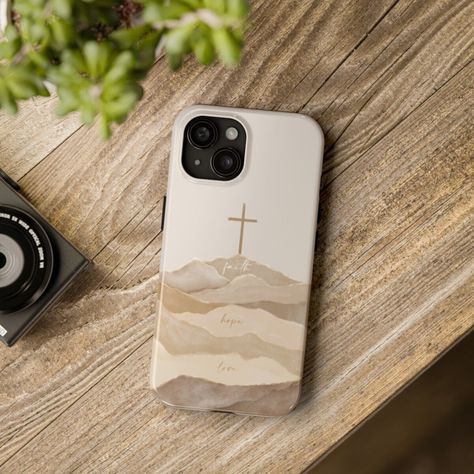 A B O U T  A R T W O R K ✎ Biblical modern and boho watercolor art of the Cross with the words: Faith, Hope, Love ----------------------------------------------------------------------------- P R O D U C T  D E T A I L S ♥ Protect your phone in a Christian-themed tough phone case. This lightweight phone case is impact resistant and comes with the perfect surface to print all your ideas in vivid detail as well as crisp color. Compatible with iPhone 7, 8, X, 11, 12, 13, 14 & more - check our avail Christian Iphone Cases, Christian Baptism, Boho Watercolor, Cross Christian, Christian Bible Quotes, Iphone Hard Case, Baptism Gifts, Faith Hope Love, Hope Love