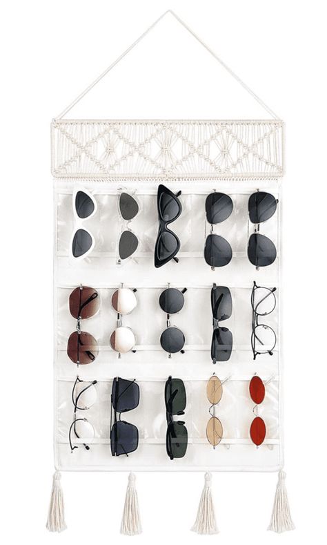 Sunglasses are a summer essential, but they can be a pain to store properly. If you’re not careful, the lenses can get scratched and the frames can become bent. Not to mention, it can be difficult to find them in a cluttered sunglasses drawer! That’s why we’ve put together a list of 10 creative ways... The post 13 Creative Ways to Store Your Sunglasses to Keep Them In Good Condition first appeared on Practical Perfection. Glasses Storage, Eyewear Display, Sunglasses Organizer, Decorative Tassels, Perfect Sunglasses, Tassels Decor, Macrame Hanging, Storage Organizer, Boho Decor