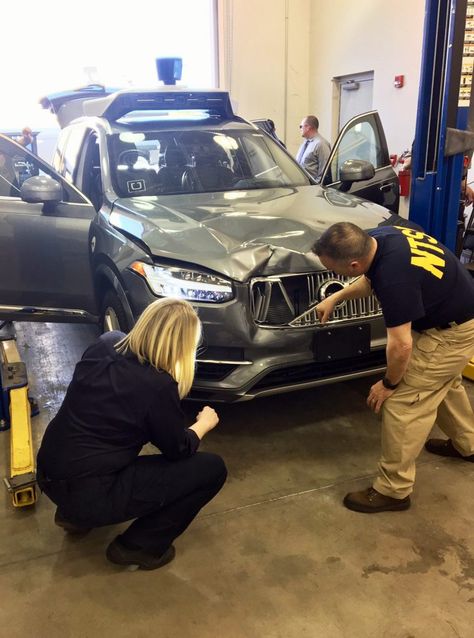 In this March 20, 2018, photo provided by the National Transportation Safety Board, investigators examine a driverless Uber SUV that fatally struck a woman in Tempe, Ariz. The fatality prompted Uber to suspend all road-testing of such autos in the Phoenix area, Pittsburgh, San Francisco and Toronto. (National Transportation Safety Board via AP) Uber Car, Car Fails, Autonomous Vehicle, Uber Driver, Traffic Safety, Mitsubishi Pajero, Self Driving, Car Photos, Amazing Cars