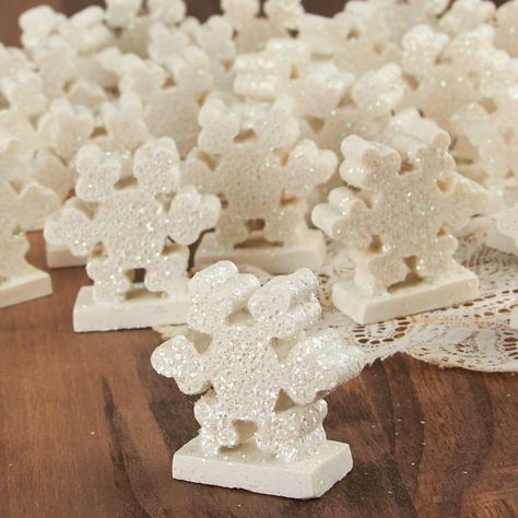 Winter Wonderland Snowflake Table Favor Set. Full of sweet, dazzling holiday charm, this standing Winter Wonderland Snowflake Table Favor Set guarantees to give your winter and Christmas surroundings a charming hint of winter and Yuletide spirit.    These small accents are perfect for the home or office as an excellent addition to your desk, mantel, end table, or coffee table. Also consider bringing enchantment to your dioramas, apothecary and Mason Jar displays, and other miniature scenes.    These items have been deeply discounted due to some excess glue at the base. With a bit of extra work the glue may be chipped away or hidden.    Made of resin. Designed for indoor use. Winter Wonderland Table Decorations, Winter Wonderland Table Setting, Snowflake Centerpieces, Snowflake Table, Winter Table Decor, Jar Display, Winter Holiday Crafts, Miniature Scenes, Table Favors