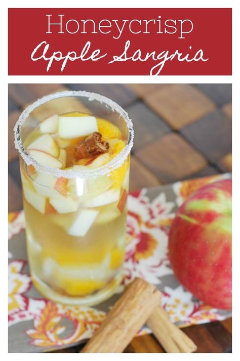 Honeycrisp Apple Sangria - the perfect fall drink! White wine sangria with honeycrisp apples, oranges, ginger, cinnamon, and cloves. Plus a cinnamon sugar rim! Orange Sangria, Apple Pie Cocktail, Cinnamon Sugar Rim, Honeycrisp Apple, Apple Sangria, White Wine Sangria, Holiday Snack, Wine Sangria, Pumpkin Cream Cheese Muffins