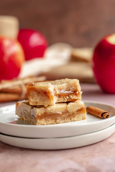 These caramel apple bars are made with a flavorful salted apple cider caramel layer, nestled in between soft and chewy cinnamon shortbread. Enjoyed at room temperature or straight from the fridge, these chewy caramel bars will be your new go-to fall dessert Salted Caramel Cookie Bars, Cinnamon Shortbread, Caramel Cookie Bars, Cider Caramel, Salted Caramel Cookie, Apple Blondies, Caramel Cookies Bars, Caramel Apple Bars, Chewy Caramel