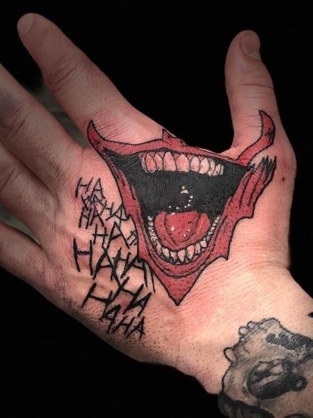 Joker Smile Hand Tattoo, Joker Hand Tattoo, Tato Joker, Joker Hand, Laugh Tattoo, Joker Face Tattoo, Joker Tattoo Design, Wife Tattoo, Evil Laugh