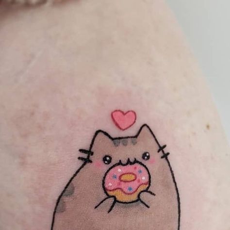 Flow Tattoo Toronto on Instagram: "Pusheen! 🍩  ▪️ Done by @megan.ellen.tattoo  ▪️ Email: inquiry@flowtattoo.com  #pusheen #pusheentattoo #donuttattoo #cutetattoo #girlswithtattoos #torontotattoo #torontotattooartist #kawaiitattoo #flowtattoo #cattattoo #cutecattattoo" Cookie Cat Tattoo, Pusheen Tattoo Ideas, Pusheen Cat Tattoo, Pusheen Tattoo, Kawaii Cat Tattoo, Studio Ghibli Cat Tattoo, Sanrio Tattoos, Donut Tattoo, Flow Tattoo