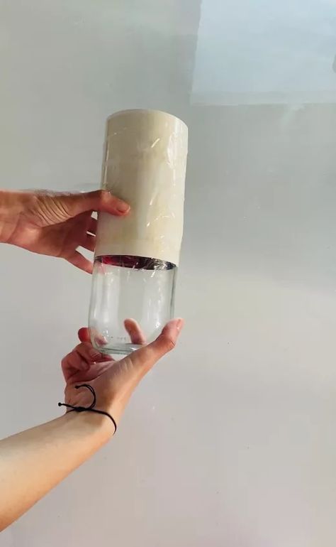 This DIY concrete &glass vase is very easy and cheap to make. Let me show you how. Materials you will need to make this project:-glass bottle, i used a milk bottle-tape-concrete mix-sanding paper Take a glass bottle.  Cut some cardstock and wrap it around the jar neck. Fix the cardstock on the jar with some tape (vertically and horizontally) Put some tape or some paper inside the jar to prevent the concrete from dripping inside your container. Mix the concrete with wat… Mini Candle Holders, Bottom Of The Bottle, Diy Concrete, Shelf Liner, Mini Candles, Diy Vase, Small Jars, Concrete Diy, Tall Vases