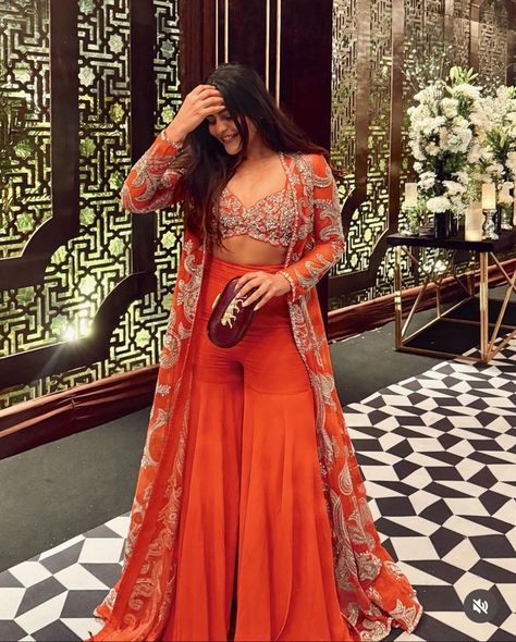 #FashionMistakes #StyleErrors #FashionFauxPas #WardrobeMistakes #FashionDonts #OutfitBlunders #StyleTips Western Indian Outfits Women, Orange Indian Lehenga, Western Wedding Ideas Dresses, Destination Wedding Indian Outfits, Trending Outfits Traditional, Designer Ethnic Wear For Women, Orange Indo Western Outfits, Indo Western Ethnic Wear, Indian Trending Outfits