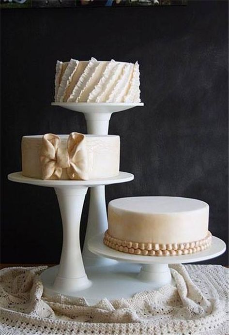 Three round wedding cakes on different leveled stands. Found on www.bridebug.com Cheese Wedding, Tiered Cake Stands, Wedding Cake Display, Tiered Cake, Wedding Pic, Simple Wedding Cake, Wedding Cake Stands, Cool Wedding Cakes, Elegant Wedding Cakes