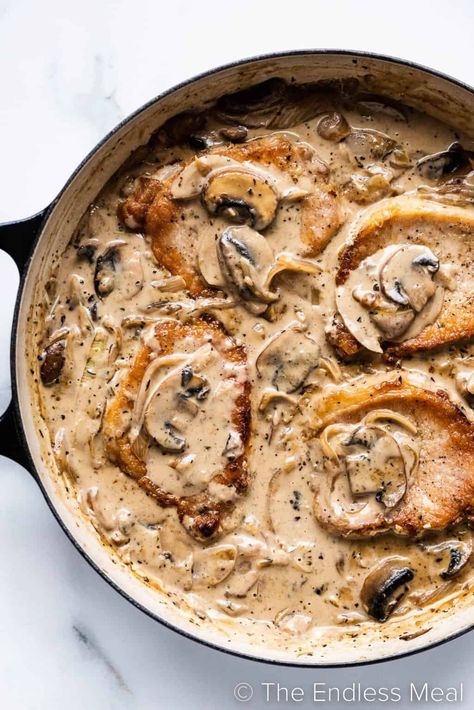 Tender smothered pork chops are pan-seared to golden perfection and then served in a savory onion and mushroom gravy. Not only is this one of our favorite ways to prepare pork chops, but it's also a quick and easy recipe for weeknights. Ready in just 25 minutes! #theendlessmeal #porkchops #smotheredporkchops #porkchopsmushrooms #porkchoprecipe Mushroom Gravy Pork Chops, Onion And Mushroom Gravy, Mushroom Onion Gravy, Pork Chop Dishes, Oven Pork Chops, Smothered Pork Chops Recipe, Mushroom Gravy Recipe, Mushroom Pork Chops, Pork Chops And Gravy