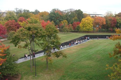 Just 21 years old and a student at Yale University, Maya Lin was plucked from obscurity and immediately plunged into controversy when her design—a visual scar on the National Mall—won the 1981 competition. The memorial invites the viewer below ground level to read the names of the war’s more than 58,000 dead and missing inscribed on the face of two 247-foot black-granite walls. Decried as an insult to veterans, the simple structure elicited such powerful emotions upon opening to the public th... Memorial Landscape, Memorial Architecture, Hart Island, Monument Park, Visit Dc, Maya Lin, Vietnam Memorial, City Parks, Landform