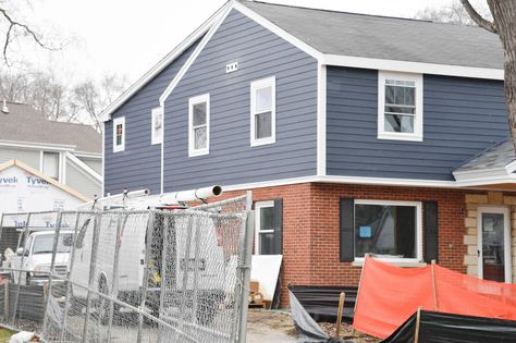 Picking Blue Exterior Siding with a Red Brick Home - Home with Keki Siding With Red Brick, Garrison Colonial Exterior, Colonial Home Renovation, Garrison Colonial, Split Level Remodel Exterior, Rock Siding, Updated Colonial, Front Extension, Stone Veneer Exterior