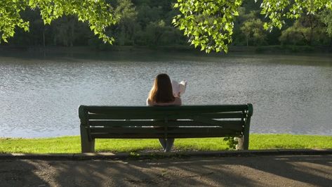 Reading Girl on a Bench in the Park by artur-dz Reading girl on a bench in the park under the trees near the lake Sitting On Park Bench Aesthetic, Sitting On Bench Reference, Park Bench Aesthetic, Park Bench Photography, Bench Aesthetic, Reading In The Park, Sitting In The Park, Sitting On A Park Bench, Bench Drawing