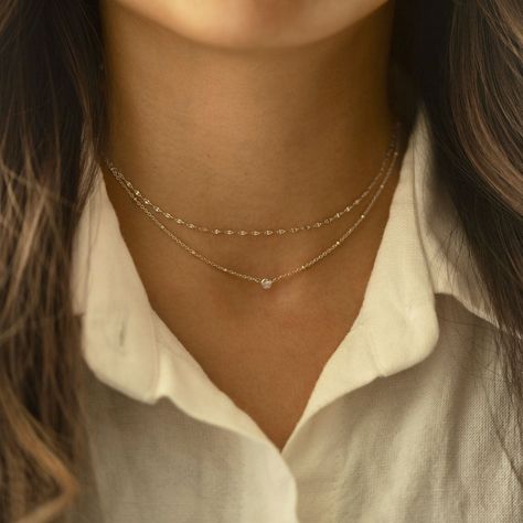 This elegant choker from our signature O Collection is great to pair with other necklaces from this collection. Our patented connectors let you easily link and layer necklaces in any order you desire. Learn more Chain Thickness 1.5mm Cubic Zirconia Diameter: 0.2in (5mm) Adjustable chain: 15-18in (38-45cm) .925 Sterling Silver Spring clasp closure Hypoallergenic, lead and nickel free #040S Simple Necklace Designs, Layer Necklaces, Necklaces Unique, Elegant Choker, Layered Choker Necklace, Silver Necklace Set, Layered Chokers, Necklace Sets, Pretty Necklaces