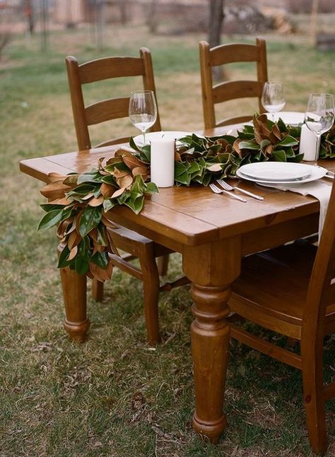 pretty details | magnolia leaves table runner Woods Party, Autumn Entertaining, Leaf Table Runner, Magnolia Leaf Garland, Magnolia Christmas, Magnolia Garland, Magnolia Leaf, Party Colors, Fall Leaf Garland