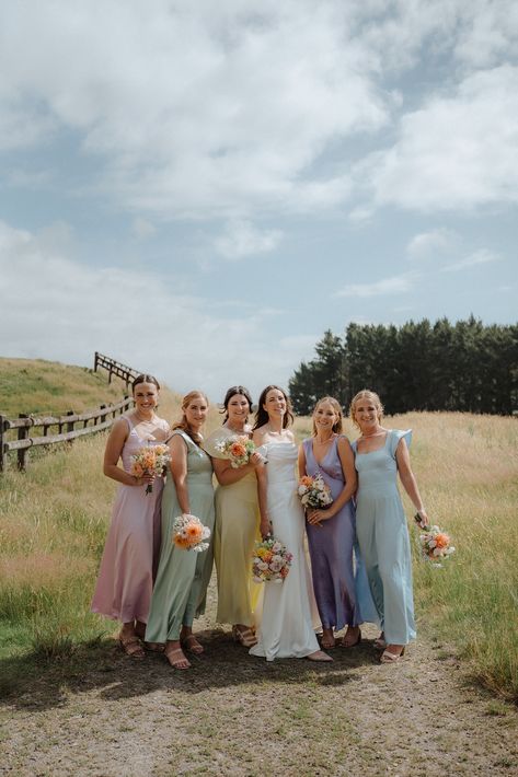 Pastel Bridal Party Dresses, Pastel Rainbow Bridesmaids, Bridesmaids With Colourful Flowers, Bridesmaids Dresses Pastel Colours, Unique Bridal Party Colors, Spring Colors Bridesmaid Dresses, Different Wedding Color Schemes, Different Pastel Bridesmaid Dresses, 5 Bridesmaids Mismatched