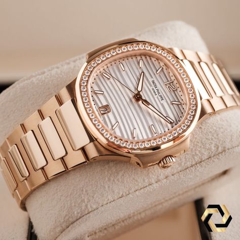 Introducing the Patek Philippe Nautilus 7118/1R automatic watch, designed especially for women who appreciate a blend of sporty elegance and luxury. Crafted in beautiful 18k rose gold, this watch features a sleek design with a simple bezel that frames the stunning silvery opaline dial. The rose gold bracelet, with its mix of polished and satin finishes, exudes sophistication and style. Plus, it comes with a new fold-over clasp that's easy to adjust for maximum comfort. You can admire the self... Patek Philippe Women Twenty 4, Rose Gold Patek Philippe, Patek Philippe Women, Patek Philippe Rose Gold, Gold Watches, Patek Philippe Watches, Modern Watches, Watch Lover, Patek Philippe Nautilus