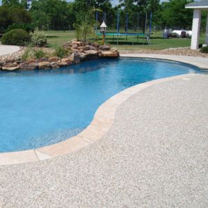 Different Types of Pool Decking | Custom Pool Decking Pool Deck Tile, Decks Around Pools, Swimming Pool Images, Deck Renovation, Pool Decking, Cheap Pool, Concrete Deck, Swimming Pool Decks, Fiberglass Swimming Pools