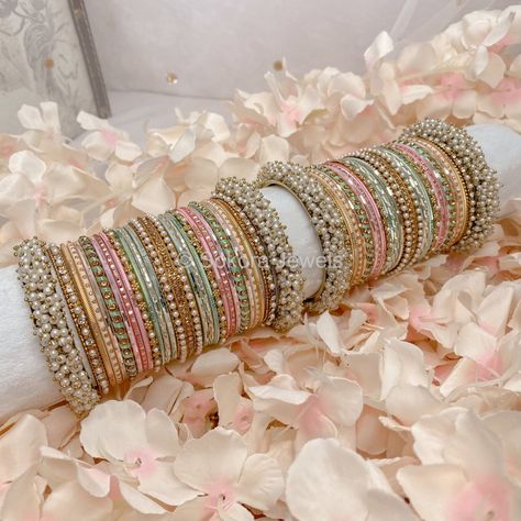 Large stack of antique gold bangles with pretty light Pastel shades of pink, mint and peach finished with sprinkles of crystals and pearls. Ready to Ship Pastel Bridal Jewellery, Pastel Indian Jewellery, Pastel Bangles, Antique Gold Bangles, Desi Jewellery, Fresh Flower Jewelry, Desi Jewelry, Bangle Stack, Pastel Jewelry