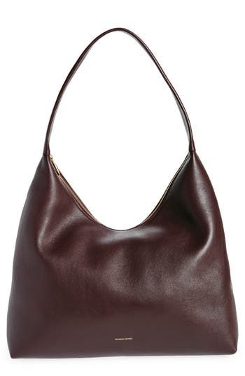 Slouchy and spacious, this oversized hobo bag is made in Italy from soft, grained leather with a supple suede lining and simple shoulder strap. Top zip closure Shoulder strap Calfskin-suede lining Leather Made in Italy Designer Handbags Oversized Crossbody Bag, Brown Leather Hobo Shoulder Bag, Slouch Shoulder Bag, Timeless Leather Hobo Bag, Clothes And Where To Buy Them, Everyday Leather-lined Shoulder Hobo Bag, Slouchy Shoulder Bag, Hobo Bag Aesthetic, Soft Leather Hobo Bag For On-the-go