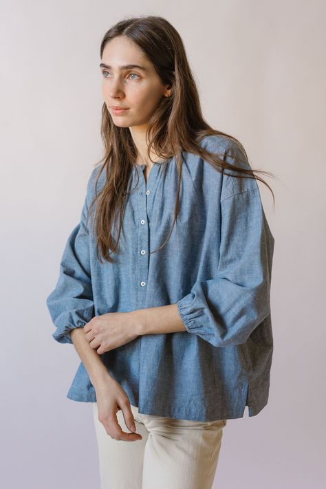 Match with your mini in the Chambray Women’s Blouse. Designed in 90% organic cotton & 10% linen chambray, and washed for extra softness, the Blouse features a billowy, relaxed fit with pearlized buttons down the front and side slits at the hem. The Blouse is an easy, breezy outfit option for sunny days making memories with your little one. 90% GOTS Certified Organic Cotton & 10% linen Washed for Extra Softness Casual Blouse Outfit, Shirt Outfits Women Casual, Modest Beach Wear, Linen Blouse Outfit, Short Top Designs, Shirt Blouse Designs, Chambray Shirt Outfits, Summer Shirts For Women, Top Designs For Women