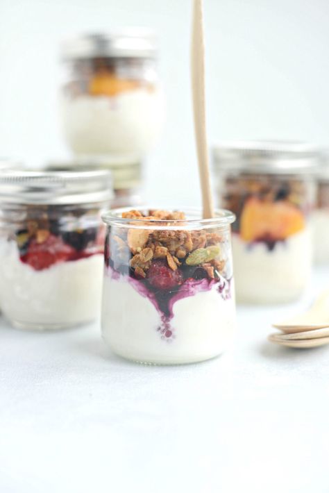 Make Ahead Yogurt Parfaits l SimplyScratch.com #easy #makeahead #yogurt #jars #breakfast #onthego #healthy #fruit #granola Glass Yogurt Jars Ideas, Mediterranean Breakfasts, French Toast Cereal, Breakfast Display, Yogurt Parfait Cups, Breakfast Jars, Freezable Breakfast, Honey Almond Granola, Fruit Granola