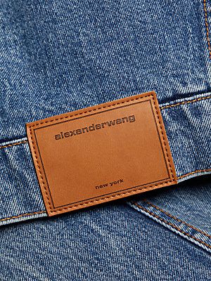 Crafted of cotton denim, this cropped jacket from Alexander Wang is elevated by a contrast faux fur trim and a quilted, satin lining. Faux fur collar Long sleeves, faux fur cuffs Back leather logo patch Button-front closures 100% cotton Filling: 100% polyester Lining: 65% acetate/35% viscose Fur type: Faux Dry clean Imported SIZE  FIT This style is constructed in a woven, no-stretch fabric for a fitted shape About 17 from shoulder to hem Bust, about 35 Model measurements: 5'10 tall Model is wear Barbie Party Dress, Leather Jacket Patches, Alexander Wang Denim, Denim Label, Badge Icon, Fur Cuffs, Embellished Denim Jacket, Fox Fur Jacket, Fur Jackets