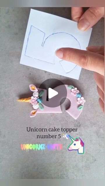 Love4sweetsandcake on Instagram: "Unicorn cake topper number 5 🦄💜  If your looking for a number cake topper in Unicorn theme, then no need to look further! This video shows step by step in an easy way how to create this cute number 5 for on top of your cake 🎂  Sometimes we don't have the right cutter in size or type to recreate what the customer desires. We don't have every type of cutter in our possession. Then you can use this tip like in the video to make your customer happy and it's a great solution. It takes more time but it's worth it and you don't have to spend money on a new cutter.  Tip: put a cocktaiI stick in the number this way u can put it on top of your cake without the number falling off.   #fondantdecoration #cakedecorating #fondanttutorial #sprinkels #fondanttricks #fon Cake With Unicorn Topper, Diy Unicorn Cake Topper, Fondant Numbers Topper, Number 5 Cake, Unicorn Theme Cake, Fondant Unicorn Cake Toppers, Unicorn Cake Design, Diy Unicorn Cake, Number Topper