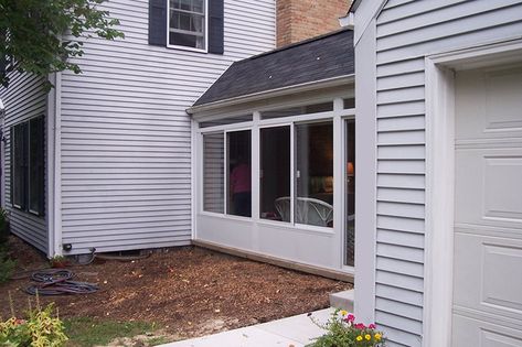 By enclosing underneath the breezeway, this family built a breakfast room next to the kitchen. Enclosed Breezeway To Garage, Breezeway To Garage, Enclosed Breezeway, Covered Walkways, Sliding Glass Windows, Small House Exteriors, Enclosed Porch, Enclosed Porches, Bedroom Patio