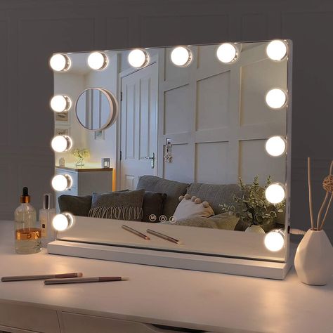 PRICES MAY VARY. Perfect size: 19.68 x15.7 inch Hollywood vanity mirror with lights meets all needs for makeup and dressing. It can completely show your face and body with its big mirror area. And it is easy to clean with a accompanying mirror cleaning cloth. 3 Light Settings & Adjustable Brightness: Fenair Lighted vanity mirror is surrounded by 14pcs Dimmable LED bulbs, three-tone setting (Warm/Cool/Natural). It can simulate different scene lighting environments to help you find the most suitab Lighted Magnifying Makeup Mirror, Hollywood Makeup Mirror, Hollywood Vanity Mirror, Hollywood Vanity, Lighted Makeup Mirror, Hollywood Lights, Vanity Mirror With Lights, Hollywood Mirror, Lighted Vanity Mirror