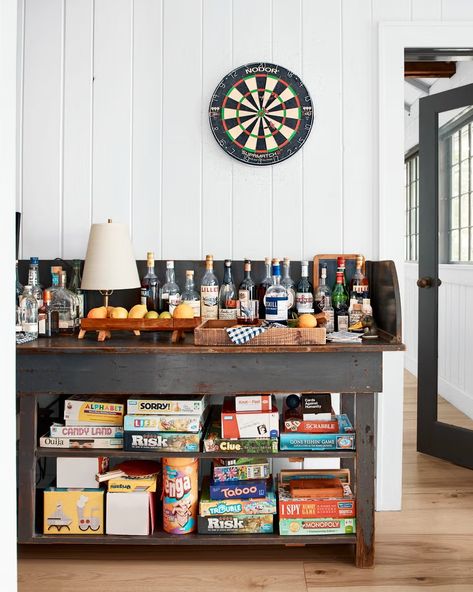 lake house game storage Lake House Games, Lake House Fishing Decor, Vintage Lake Cabin Decor, Lake House Game Room, House Game Room, Lake House Backyard Homemade Games, Lake House Decorating, Lake House Decorating Ideas, Lake House Decor Paintings & Prints