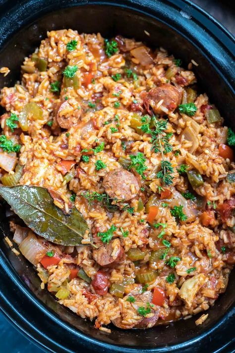 Celebrate Mardi Gras with this Chicken and Sausage Slow Cooker Jambalaya Recipe. A Cajun favorite made super easy right in your crockpot. A fun, flavorful and festive dinner idea. #slowcookerrecipes #crockpotrecipes #mardigrasrecipes #jambalayarecipes #jambalaya #cajunrecipes #slowcookerjambalaya #chickenricerecipes #easydinnerrecipes Jambalaya Slow Cooker, Brown Rice Jambalaya, Jambalaya Recipe Slow Cooker, Jambalaya Recipe Crockpot, Sausage Slow Cooker, Chicken Jambalaya, Slow Cooker Jambalaya, Chicken And Sausage Jambalaya, Sausage Jambalaya