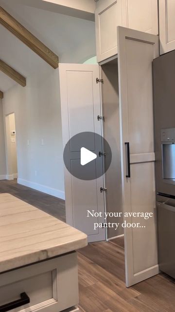 Pantry Design With Costco Door, Hidden Garage Door In Kitchen, Pantry With Garage Access, Pantry Garage Door, Grocery Door From Garage, Hidden Pantry Walk In Kitchens, Integrated Pantry, Hidden Pantry Door In Kitchen, Floor To Ceiling Pantry Cabinets