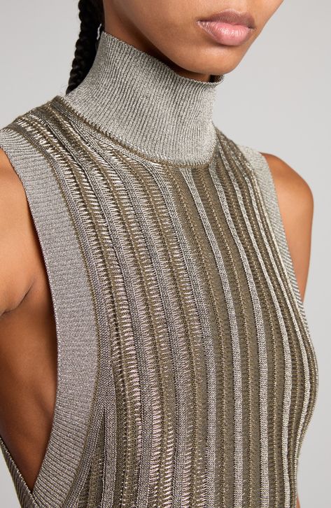 Metallic fibers bring eye-catching shimmer to this slinky sweater-dress fashioned with a high mock neck and deeply carved armholes. 35" length (size Medium) Slips on over head Mock neck Sleeveless 60% virgin wool, 28% viscose, 12% metallic fibers Unlined Dry clean Made in Italy Designer Clothing Metalic Outfits Ideas, Modern Knitwear, Buy List, Metallic Knit, Metallic Sweater, Knitwear Fashion, Winter Trends, Glitz And Glam, Chapter 3