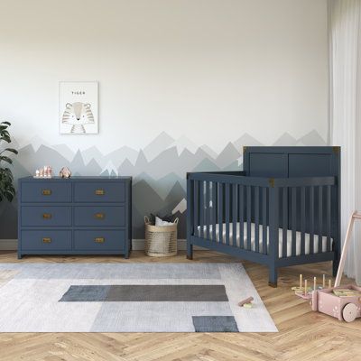 Create a space that is fun and sophisticated with the delightful Hubble 5-in-1 convertible crib and dresser set. Combining campaign and modern style, this charismatic set is crafted with sturdy wood construction and features a full panel headboard, vertical slats footboard, and simple post-style legs. Sleek and safe, the crib comes equipped with four mattress positions that allow you to adjust the height of the platform as your child grows. When your child is ready, the Hubble conveniently conve Navy Nursery Furniture, Navy Nursery Neutral, Blue Mountain Nursery, Dark Blue Nursery, Baby Boy Nusery, Baby Boy Blue Nursery, Navy Nursery Boy, Cream Nursery, Vertical Slats