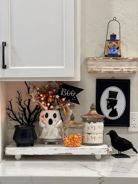 This spooky little kitchen vignette was so fun and easy to do! Even if you don’t have the exact same Halloween Decor, you can take the basic idea and use what you do have. I do have a reel showing how I put this together and tagged some of the Decor in it. You can find that on my page KH_Decor Follow along for more! ( Halloween, spooky, ghost, treats, decor, accents, kitchen) Halloween Open Shelves, Halloween Decor Above Cabinets, How To Store Home Decor Items, Indoor Ghost Decor, Halloween Dresser Decor, Halloween Countertop Decorations, Halloween Decorations Shelves, Counter Halloween Decor, Halloween Decor Shelves