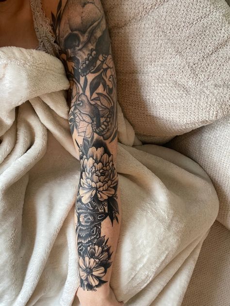 Dark Themed Sleeve Tattoos, Floral And Skull Tattoo Sleeve, Floral Tattoo With Skull, Skull With Floral Tattoo, Bones And Floral Tattoo, Skull Floral Tattoo Sleeve, Moths Tattoo Sleeve, Feminine Gothic Tattoo Sleeves, Floral Insect Sleeve Tattoo