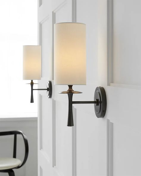 The Drunmore Single Sconce by AERIN combines traditional design with contemporary detailing. The modern design is finished in solid bronze or bronze with crystal detailing, and the elongated shade in either linen or white glass casts abundant illumination for hallways or bathrooms. Ideal as a pair or in multiples.Height : 14.25"Width : 4.5"Extension : 6.75"Backplate : 4.5" RoundSocket : E12 CandelabraWattage : 40 B11Shade Details : 4.5" x 4.5" x 8.5"Weight : 2 lbs. Living Room With Sconces, Light Sconces Living Room, Wall Scones Decor Ideas, Sconces Black, Hallway Sconces, Farmhouse Wall Sconces, Traditional Light Fixtures, Wall Lights Living Room, Sconces Living Room