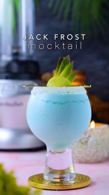 Swarna | Recipe video creator on Instagram: "Chill out with the frosty allure of Jack Frost Mocktail 🍸😍 You’ll need: 2 cups frozen coconut milk 60 ml blue curaçao syrup @moninindia (non -alcoholic) 150 ml simple syrup 7 ml lemon juice 60 ml pineapple juice Lemon wheel for garnish - Blend till smooth. - Coat the glass rim with honey and coconut flakes. - Pour in the drink and serve immediately. - Enjoy ☺️" Jack Frost Mocktail Recipe, Jack Frost Drink, Video Creator, Blue Curacao, Mocktail Recipe, Juice Drinks, Recipe Video, Pineapple Juice, Jack Frost