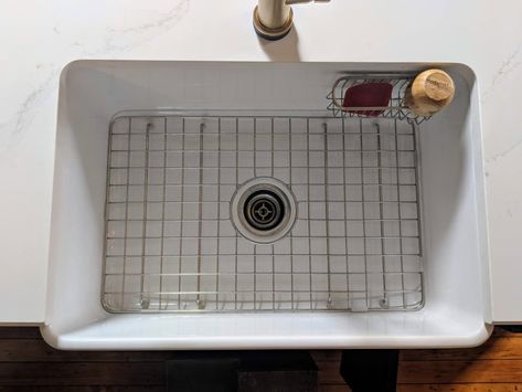 What They Don’t Tell You About Those Kitchen Sink Grids | Kitchn Farmhouse Sink Protector, Farmhouse Kitchen Sink Accessories, Painting A Sink, Kitchen Sink Sizes, Kitchen Sink Install, New Kitchen Sink, Farmers Sink, Clean Kitchen Sink, Sink Drying Rack