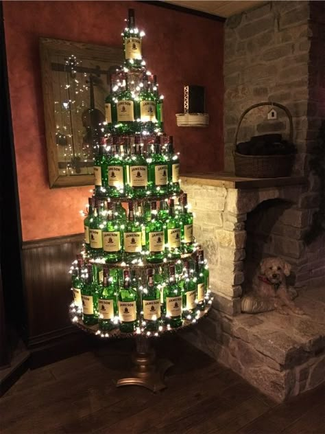 VSCO - Our Jameson Irish Whiskey bottle christmas tree in our Ould Sod Pub!!!!!! Feature our Irish Lucky dog!!!! | katefitz51 Christmas Tree For Cabin, Irish Pub Christmas Decor, Christmas Decorations Bar Restaurant, Irish Pub Decor Ideas, Liquor Store Christmas Decorations, Pub Christmas Decor, Irish Christmas Tree, Christmas Pub Decorations, Pub Christmas Decorations