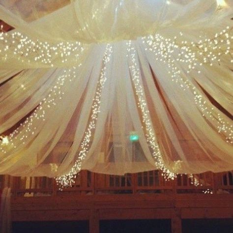 Do you enjoy the look of tulle and lights together? If so, we give you ideas on how you can create this look in your home! Tulle Lights, White Lights, Fairytale Wedding, Here Comes The Bride, Marry Me, Wedding Bells, Sweet 16, Future Wedding, Party Planning