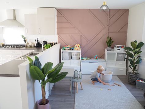 Open-plan Kitchen & Playroom Makeover with Sulking Pink Panelled Feature Wall. Storage from Great Little Trading Company Open Plan Playroom, Panelled Feature Wall, House Playroom, Playroom Layout, Dining Room Playroom, Playroom Makeover, Kitchen Playroom, Living Room Playroom, Open Plan Kitchen Dining