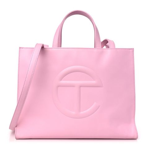 This is an authentic TELFAR Vegan Leather Medium Shopping Bag in Bubblegum.This is a tote crafted of synthetic leather in pink with the iconic raised Telfar logo at the front. The shoulder bag has short top handles and two long shoulder straps. The top secures with a magnet snap and opens toa pink fabric-lined interior with a pocket. Large Pink Telfar Bag, Telfair Bag, Telfar Pink Bag, Purse Telfar, Pink Telfar Bag, Medium Telfar Bag, Pink Telfar, Telfar Logo, Telfar Bags