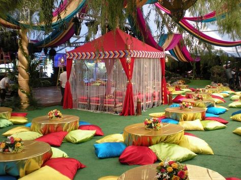 raj tents, moroccan theme, colorful, party, cabana | I love all the floor pillows and the colorful curtains on the tent for this East Indian, Moroccan, or Arabian nights party Dekorasi Maroko, Moroccan Theme Party, Fabric Streamers, Arabian Party, Arabian Nights Theme, Moroccan Tent, Arabian Nights Party, India Decor, Moroccan Party