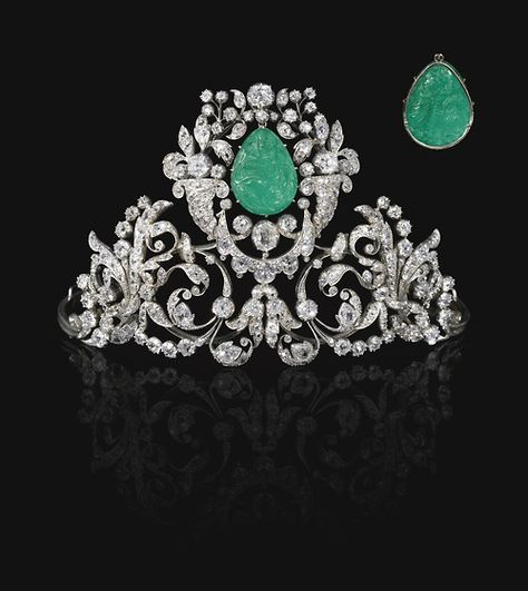 FROM THE COLLECTION OF A GERMAN PRINCESS -  Emerald and diamond tiara, 19th century - Composed of foliate, scroll and swag motifs set with cushion-shaped, circular-cut, oval and rose diamonds, claw-set with a carved emerald depicting the Madonna and Child to the front and the Annunciation to the reverse, inner circumference approximately 350mm, emerald possibly later set. Carved Emerald, The Annunciation, The Madonna, Royal Crowns, Royal Tiaras, Diamond Tiara, Madonna And Child, Royal Jewels, Royal Jewelry