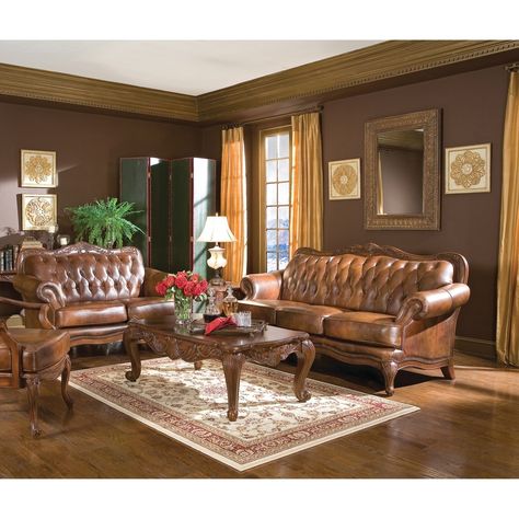 Elegant details of ornately carved wood curving to flow effortlessly into ball and claw inspired feet give this two-piece loveseat and sofa set timeless vintage appeal. The smooth tri-tone faux leather upholstery with deep button tufting adds a traditional dimension to a formal and gracious living room. Features: Set includes: One (1) sofa and one (1) loveseat Materials: Faux Leather and Wood Finish: Brown Special Features: Style: Traditional Dimensions: Sofa dimensions: 43 inches high x 86 inch Elegant Living Room Furniture, Sofa Kulit, Brown Furniture Living Room, Modern Living Room Set, Leather Living Room Furniture, Furnitur Ruang Keluarga, Leather Living Room, Set Sofa, Brown Leather Sofa